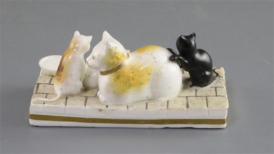 A Rockingham porcelain group of a cat and three kittens, c.1826-30, L. 11cm